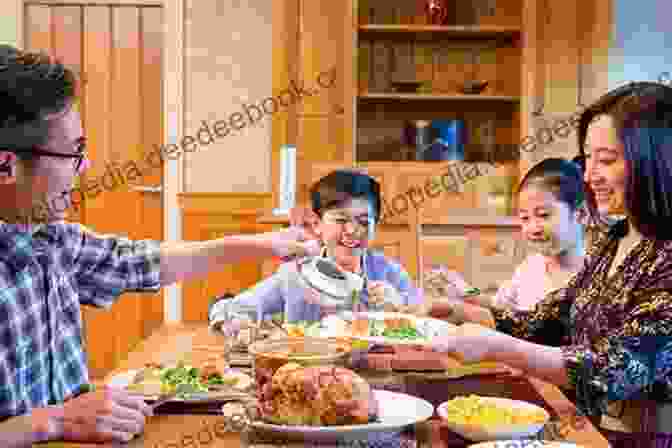 An Asian American Family Sitting At A Table, Eating A Meal Together. Asian American Panethnicity: Bridging Institutions And Identities (Asian American History And Culture)